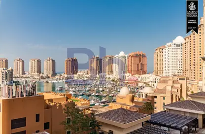 Outdoor Building image for: Apartment - 1 Bedroom - 2 Bathrooms for rent in One Porto Arabia - Porto Arabia - The Pearl Island - Doha, Image 1