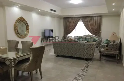 Living / Dining Room image for: Apartment - 1 Bedroom - 2 Bathrooms for sale in Tower 9 - Porto Arabia - The Pearl Island - Doha, Image 1