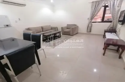 Living / Dining Room image for: Apartment - 1 Bedroom - 2 Bathrooms for rent in Najma 28 - Ibn Dirhem Street - Najma - Doha, Image 1
