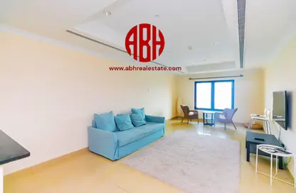 Living Room image for: Apartment - 1 Bathroom for sale in East Porto Drive - Porto Arabia - The Pearl Island - Doha, Image 1
