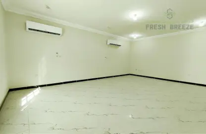 Empty Room image for: Compound - 5 Bedrooms - 4 Bathrooms for rent in Ain Khaled - Ain Khaled - Doha, Image 1