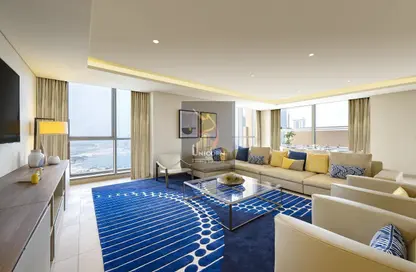 Living Room image for: Penthouse - 3 Bedrooms - 3 Bathrooms for rent in Voco Doha West Bay Suites - West Bay - Doha, Image 1