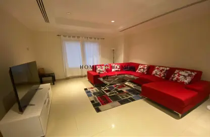 Living Room image for: Apartment - 1 Bedroom - 2 Bathrooms for sale in Porto Arabia - The Pearl Island - Doha, Image 1
