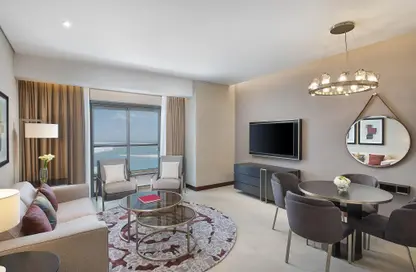 Living / Dining Room image for: Apartment - 1 Bedroom - 2 Bathrooms for rent in Hilton Doha The Pearl Residences - Abraj Quartiers - The Pearl Island - Doha, Image 1
