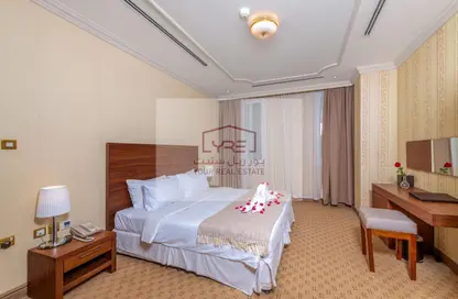 Room / Bedroom image for: Apartment - 1 Bedroom - 2 Bathrooms for rent in Al Sadd Road - Al Sadd - Doha, Image 1