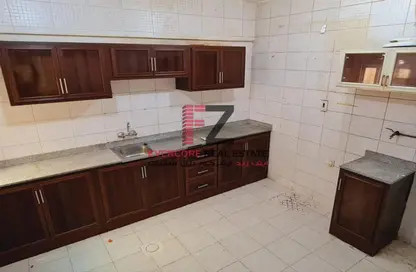 Kitchen image for: Apartment - 3 Bedrooms - 3 Bathrooms for rent in Thabit Bin Zaid Street - Al Mansoura - Doha, Image 1