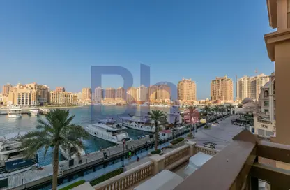 Outdoor Building image for: Townhouse - 2 Bedrooms - 3 Bathrooms for rent in Porto Arabia Townhouses - Porto Arabia - The Pearl Island - Doha, Image 1