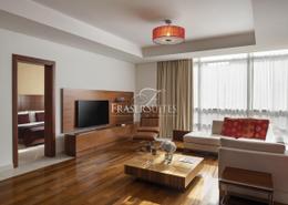 صورةغرفة المعيشة لـ: شقة - 1 غرفة نوم - 1 حمام للكراء في فريزر سويتس - شارع الكورنيش - الدوحة, صورة 1