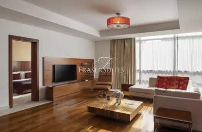 Living Room image for: Apartment - 1 Bedroom - 1 Bathroom for rent in Fraser Suites - Corniche Road - Doha, Image 1