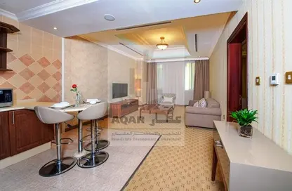 Living / Dining Room image for: Apartment - 1 Bedroom - 2 Bathrooms for rent in Al Qawafell Street - Al Sadd - Doha, Image 1