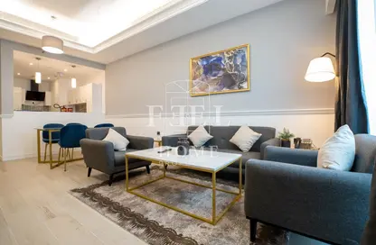Living Room image for: Apartment - 1 Bedroom - 2 Bathrooms for rent in Al Jassim Tower - C-Ring Road - Al Sadd - Doha, Image 1