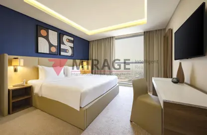 Room / Bedroom image for: Apartment - 1 Bedroom - 2 Bathrooms for rent in West Bay - Doha, Image 1