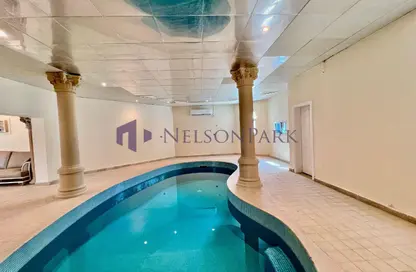 فيلا - 8 غرف نوم - 8 حمامات للايجار في شارع عنيزة - الحي الدبلوماسي - الدوحة