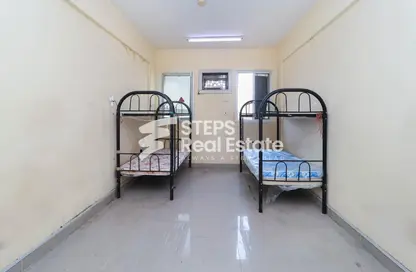 Room / Bedroom image for: Labor Camp - Studio for rent in Industrial Area 4 - Industrial Area - Industrial Area - Doha, Image 1