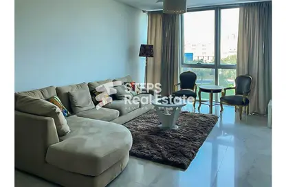 Living Room image for: Apartment - 2 Bedrooms - 4 Bathrooms for sale in Zig Zag Tower A - Zig Zag Towers - West Bay - Doha, Image 1