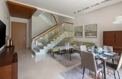 Living / Dining Room image for: Duplex - 2 Bedrooms - 3 Bathrooms for rent in Musheireb Tower - Musheireb - Musheireb - Doha, Image 1
