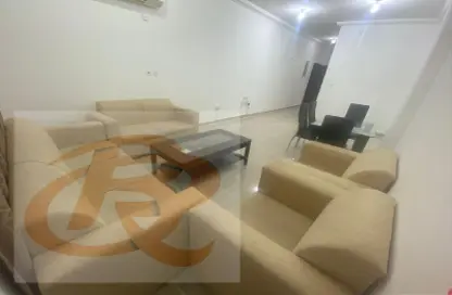 Living Room image for: Apartment - 2 Bedrooms - 2 Bathrooms for rent in M Residence 2 - Fereej Bin Mahmoud North - Fereej Bin Mahmoud - Doha, Image 1