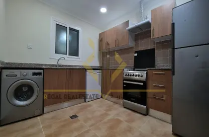 Kitchen image for: Apartment - 2 Bedrooms - 2 Bathrooms for rent in Um Salal shops - Umm Salal Mohammed - Doha, Image 1