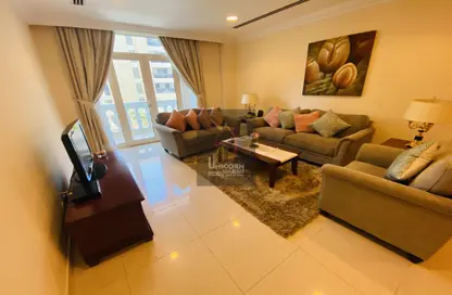 Living Room image for: Apartment - 2 Bedrooms - 2 Bathrooms for rent in Riviera Residences - Fereej Bin Mahmoud South - Fereej Bin Mahmoud - Doha, Image 1