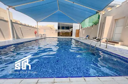 Pool image for: Villa - 4 Bedrooms - 3 Bathrooms for rent in Al Hanaa Street - Al Gharrafa - Doha, Image 1