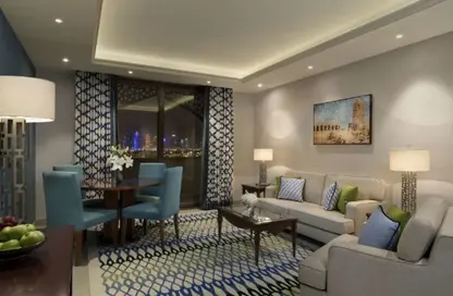 صورة لـ غرفة المعيشة / غرفة الطعام شقة - 2 غرف نوم - 2 حمامات للايجار في شارع الكورنيش - شارع الكورنيش - الدوحة ، صورة رقم 1