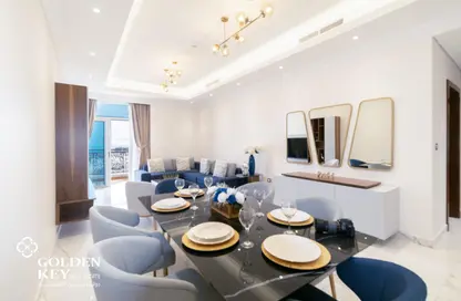 Living / Dining Room image for: Apartment - 2 Bedrooms - 3 Bathrooms for rent in Floresta Gardens - Floresta Gardens - The Pearl Island - Doha, Image 1