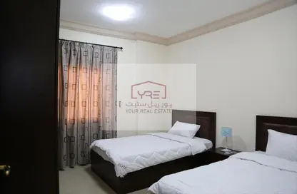 Room / Bedroom image for: Apartment - 2 Bedrooms - 2 Bathrooms for rent in Al Mansoura - Al Mansoura - Doha, Image 1