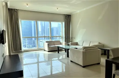 Living / Dining Room image for: Apartment - 2 Bedrooms - 2 Bathrooms for rent in Beach Tower - West Bay - West Bay - Doha, Image 1
