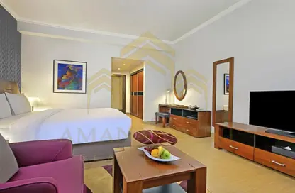 صورة لـ غرفة المعيشة شقة - 1 حمام للايجار في شارع الدبلوماسي - الخليج الغربي - الدوحة ، صورة رقم 1