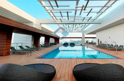 صورة لـ حوض سباحة شقة - 2 غرف نوم - 3 حمامات للايجار في مركز المدينة - مدينة قطر الترفيهية - الوسيل ، صورة رقم 1