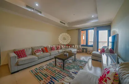 Living Room image for: Apartment - 1 Bedroom - 2 Bathrooms for sale in East Porto Drive - Porto Arabia - The Pearl Island - Doha, Image 1