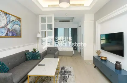 صورة لـ غرفة المعيشة شقة - 1 حمام للايجار في سلاطة الجديدة - سلاطة الجديدة - سلاطة - الدوحة ، صورة رقم 1