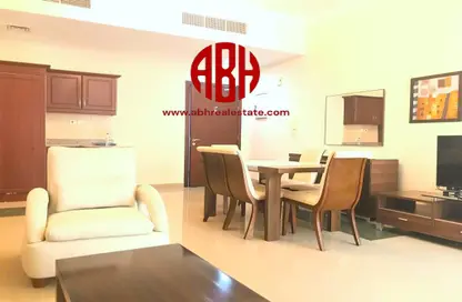Living / Dining Room image for: Apartment - 1 Bedroom - 2 Bathrooms for rent in Baraha North 1 - Baraha North Apartments - Msheireb Downtown Doha - Doha, Image 1