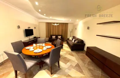 Living / Dining Room image for: Apartment - 2 Bedrooms - 2 Bathrooms for rent in Al Sadd - Doha, Image 1