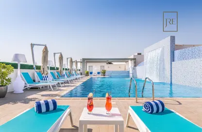 صورة لـ حوض سباحة شقة - غرفة نوم - 1 حمام للايجار في رويال بلازا - السد - الدوحة ، صورة رقم 1