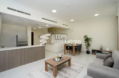 Living / Dining Room image for: Duplex - 2 Bedrooms - 3 Bathrooms for sale in Lusail City - Lusail, Image 1