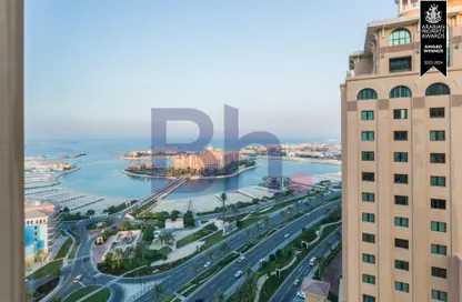 Outdoor Building image for: Apartment - 1 Bedroom - 2 Bathrooms for rent in Tower 13 - Porto Arabia - The Pearl Island - Doha, Image 1