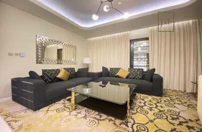 Living Room image for: Apartment - 1 Bedroom - 2 Bathrooms for rent in East Porto Drive - Porto Arabia - The Pearl Island - Doha, Image 1