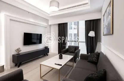 Living Room image for: Apartment - 1 Bedroom - 2 Bathrooms for sale in Bin Al Sheikh Towers - Al Mirqab Al Jadeed - Doha, Image 1