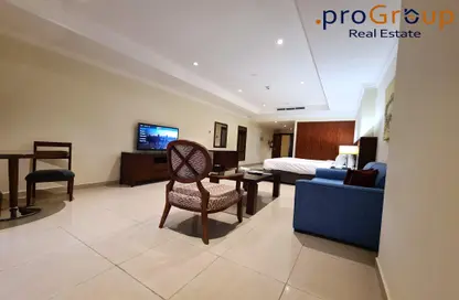 Living Room image for: Apartment - 1 Bathroom for rent in East Porto Drive - Porto Arabia - The Pearl Island - Doha, Image 1