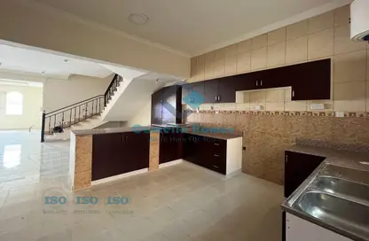 Kitchen image for: Compound - 4 Bedrooms - 5 Bathrooms for rent in Ain Khaled - Ain Khaled - Doha, Image 1