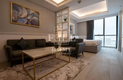 Living Room image for: Apartment - 1 Bathroom for sale in Bin Al Sheikh Towers - Al Mirqab Al Jadeed - Doha, Image 1