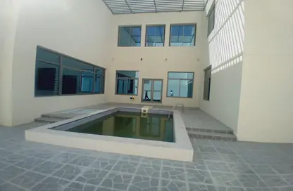 صورة لـ حوض سباحة فيلا - 7 غرف نوم - 7 حمامات للبيع في العب - الخيصة - أم صلال محمد ، صورة رقم 1