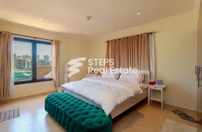 Room / Bedroom image for: Apartment - 2 Bedrooms - 2 Bathrooms for sale in West Porto Drive - Porto Arabia - The Pearl Island - Doha, Image 1