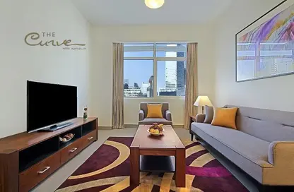 Living Room image for: Apartment - 1 Bedroom - 2 Bathrooms for rent in West Bay - Doha, Image 1