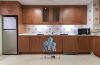 Kitchen image for: Apartment - 1 Bedroom - 2 Bathrooms for rent in Porto Arabia - The Pearl Island - Doha, Image 1