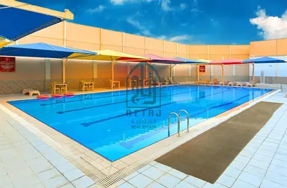 صورة لـ حوض سباحة مجمع سكني - 6 غرف نوم - 5 حمامات للايجار في شارع  بو هامو - أبو هامور - الدوحة ، صورة رقم 1