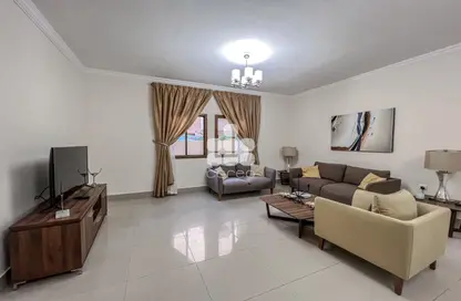 Living Room image for: Apartment - 2 Bedrooms - 2 Bathrooms for rent in Ain Khaled Villas - Ain Khaled - Doha, Image 1