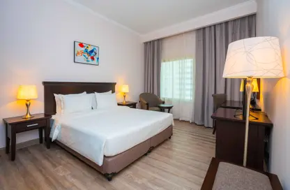 Room / Bedroom image for: Apartment - 1 Bathroom for rent in Ezdan Hotel and Suites - West Bay - Doha, Image 1