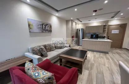 Living Room image for: Apartment - 1 Bedroom - 2 Bathrooms for rent in Al Doha Plaza - Al Sadd - Al Sadd - Doha, Image 1